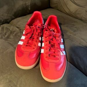 Red women’s adidas sambas sneakers